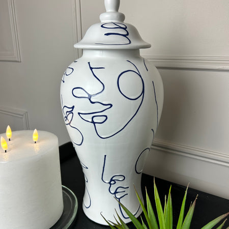 Faces white blue ceramic ginger jar