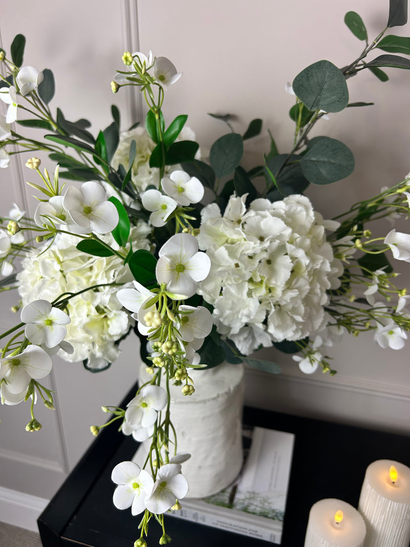 Eucalyptus, white hydrangeas and Florence spray stem arrangement