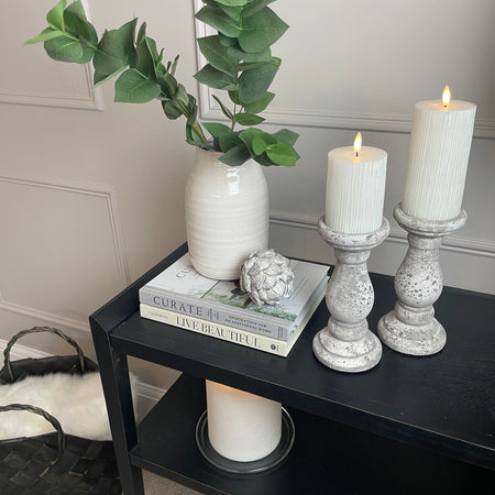 Set of two stone candle sticks