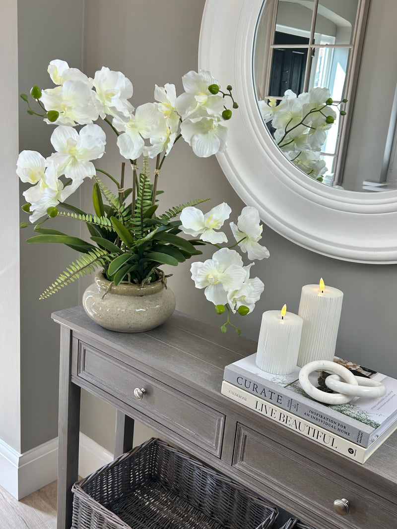 White vanda orchid in ceramic planter pot