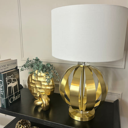 Gold metal round chunky lamp with white shade