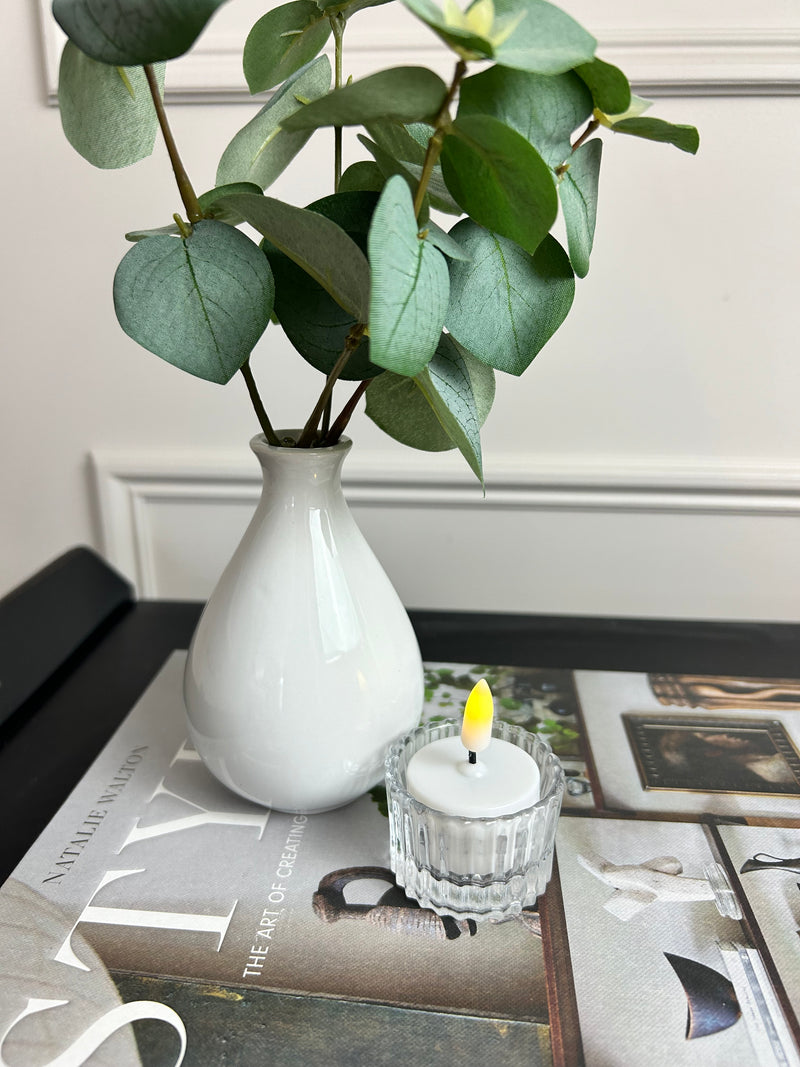 White vase with eucalyptus