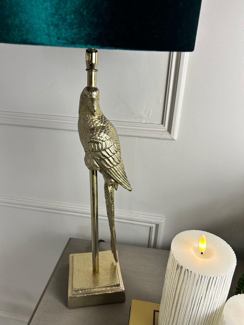 Gold parrot lamp with emerald green shade