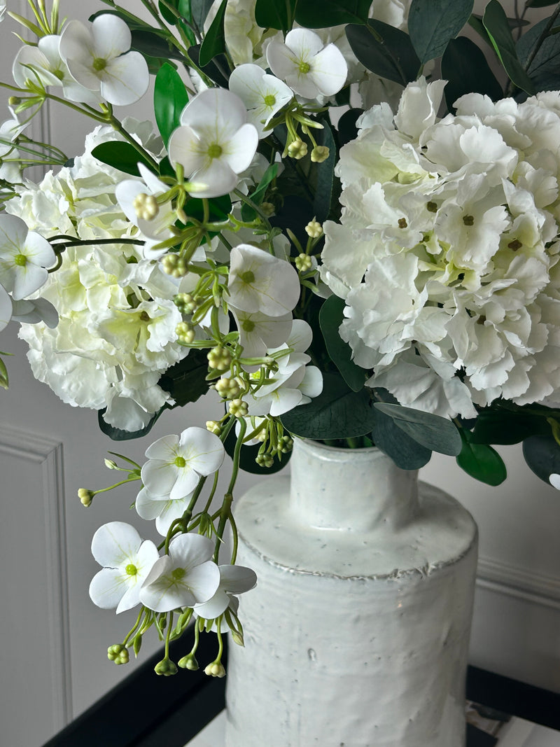 Eucalyptus, white hydrangeas and Florence spray stem arrangement