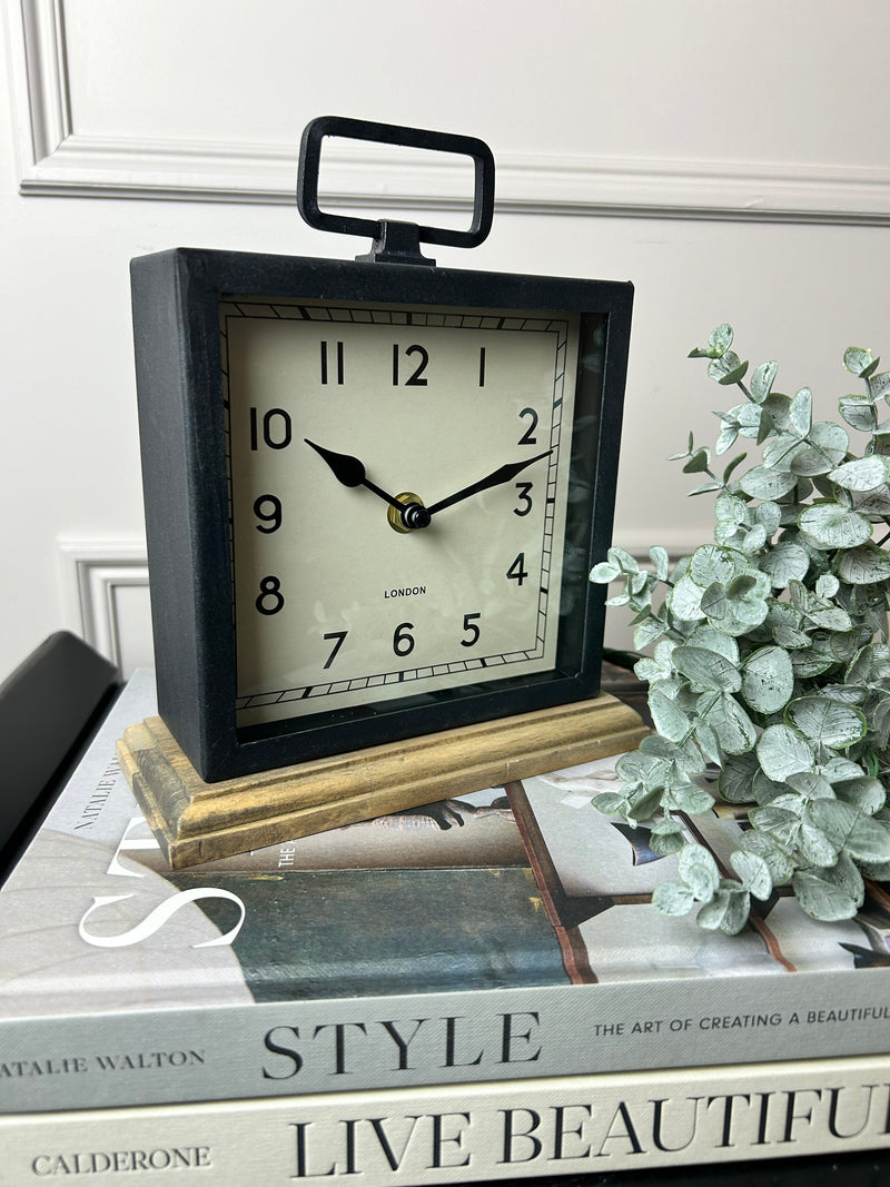 Black wooden based metal clock