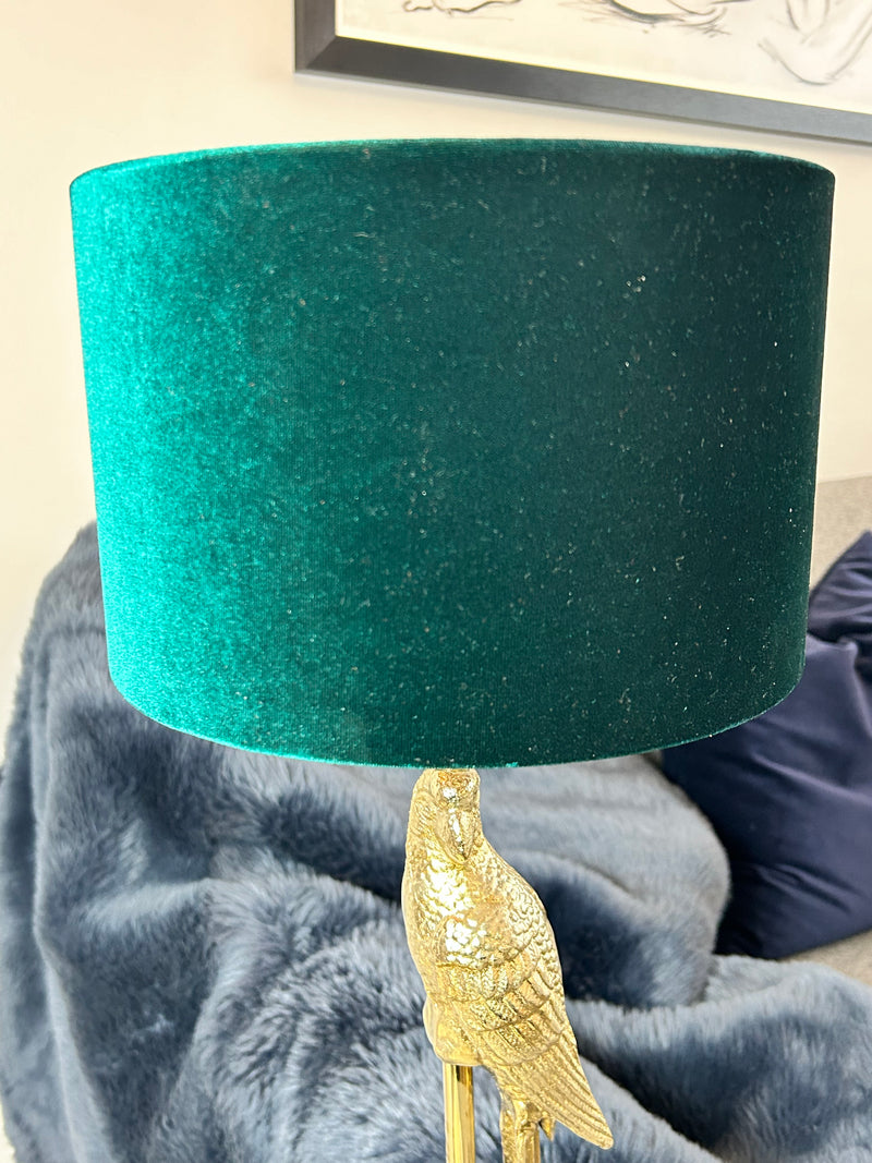 Gold parrot lamp with emerald green shade