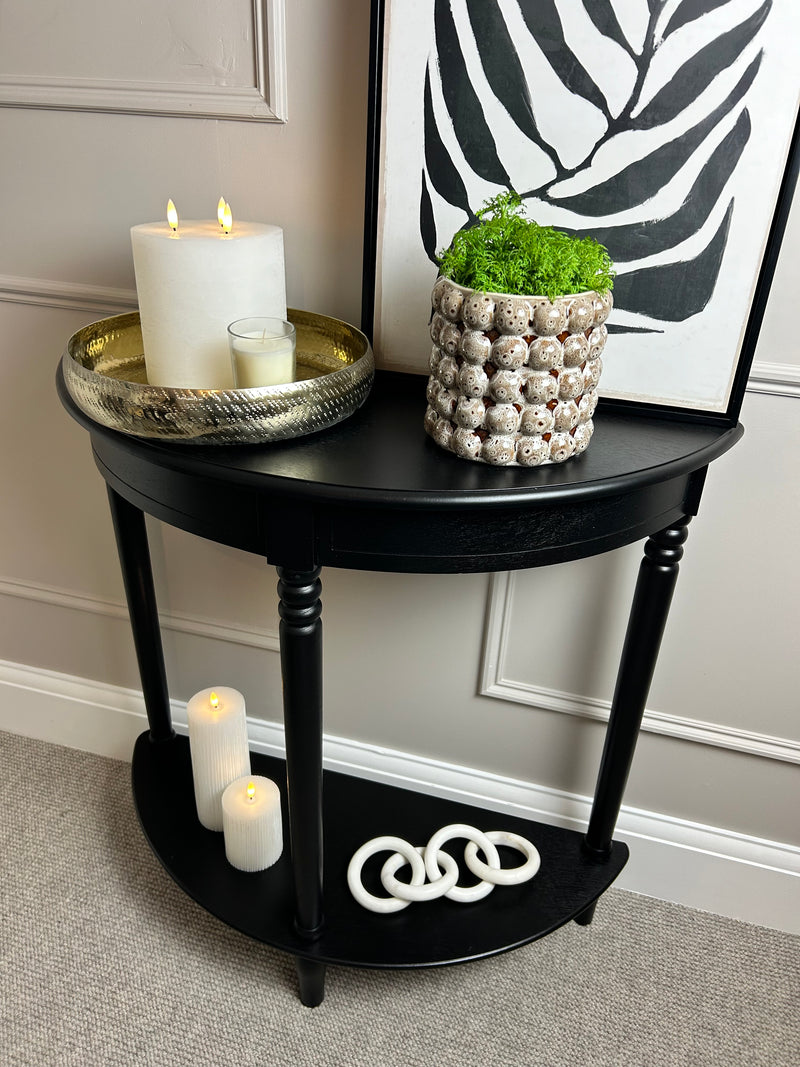 Black half moon table with turned legs
