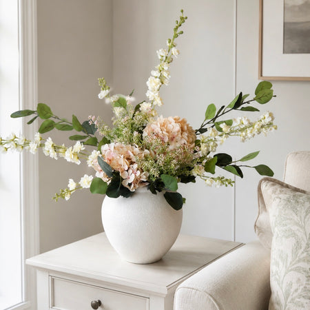 Pale pink and cream delphinium berry arrangement