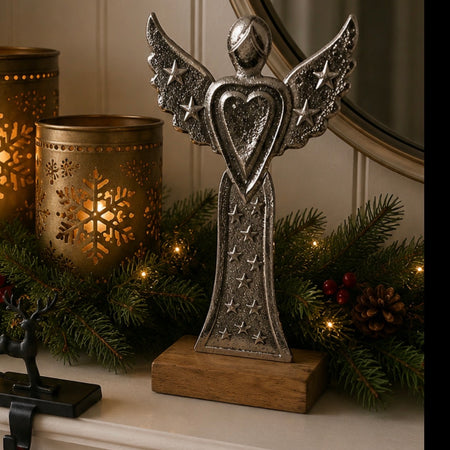 Standing angel metal on stand