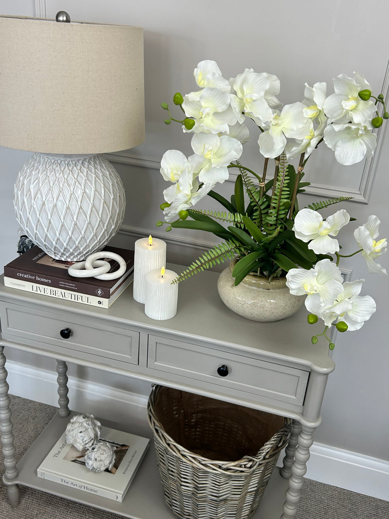 White vanda orchid in ceramic planter pot