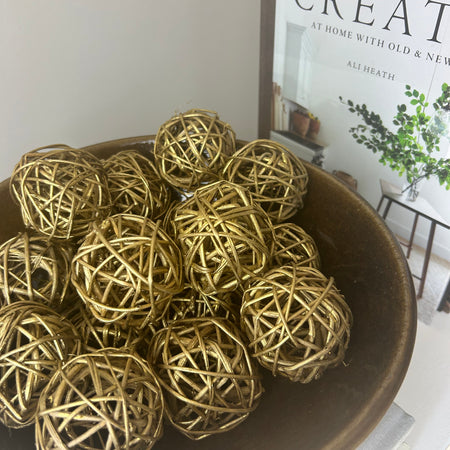 Woven gold balls in bag