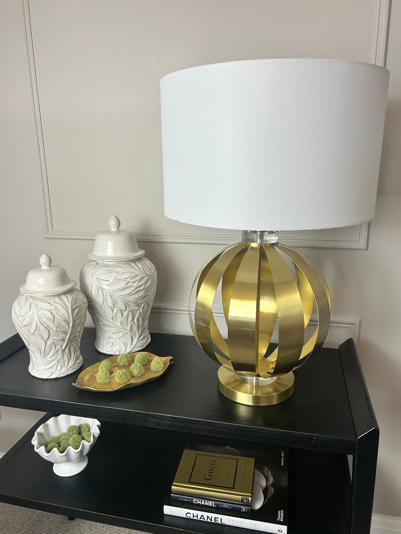 Gold metal round chunky lamp with white shade
