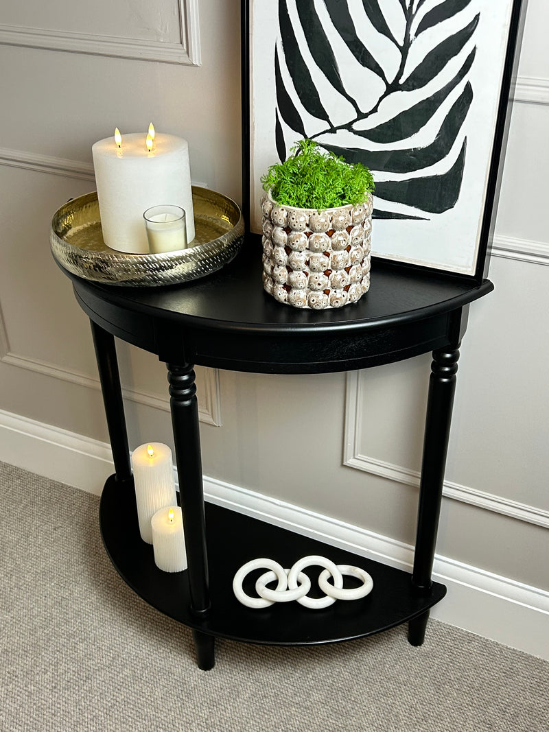 Black half moon table with turned legs