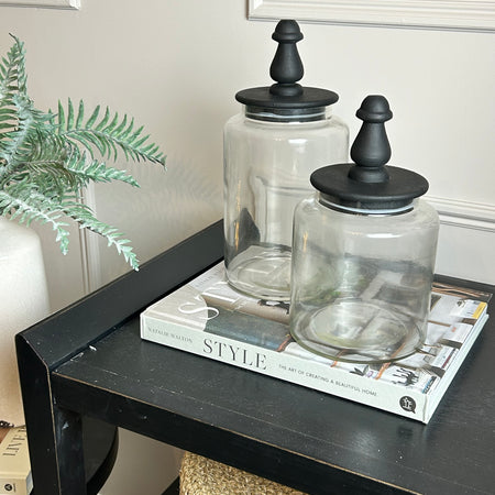 Glass jar with finial black lid