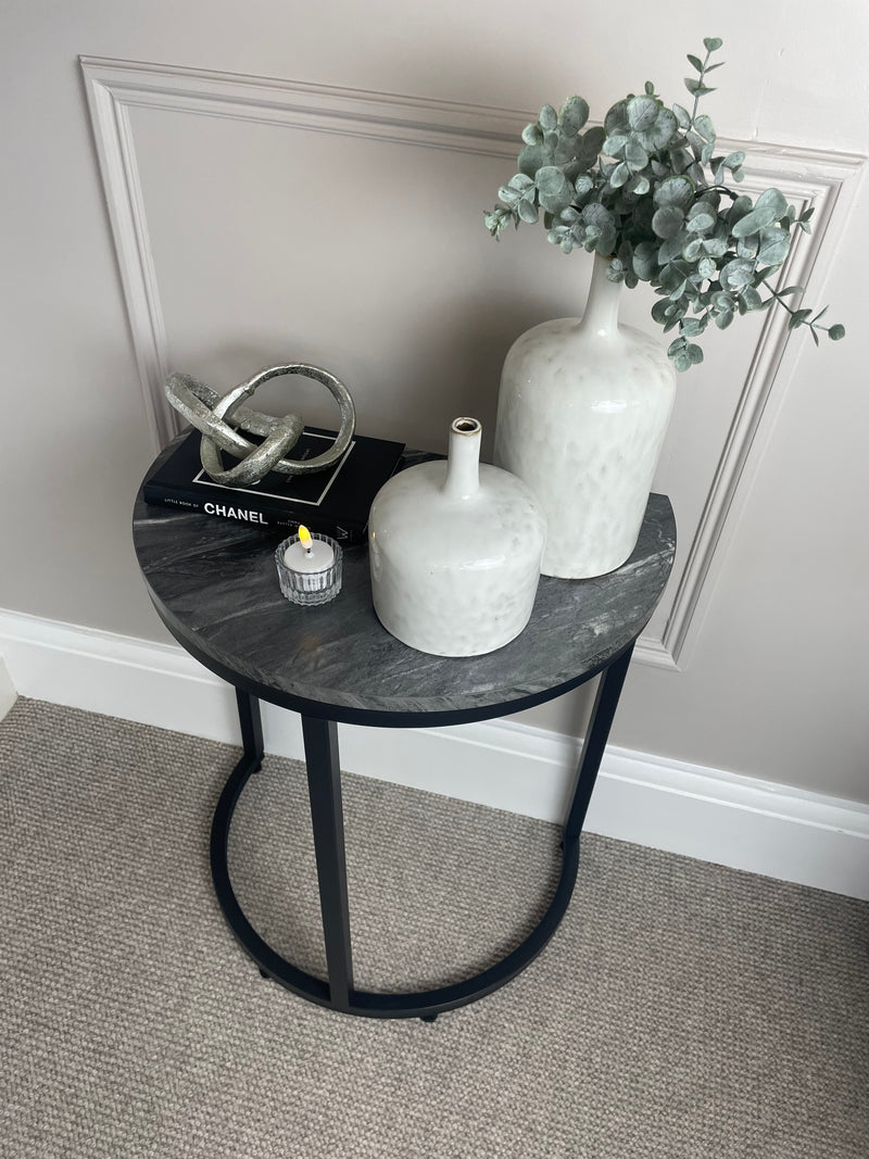 Black marble look top half moon table