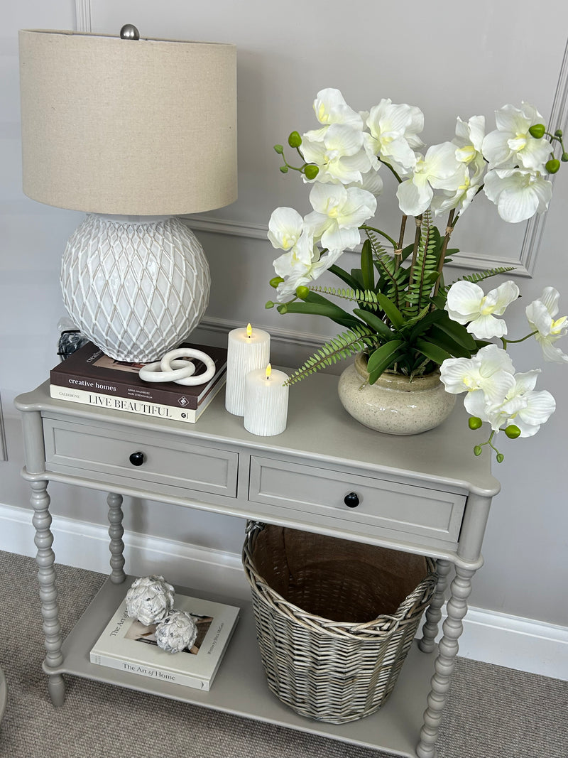 Neutral taupe console table with textured beaded legs