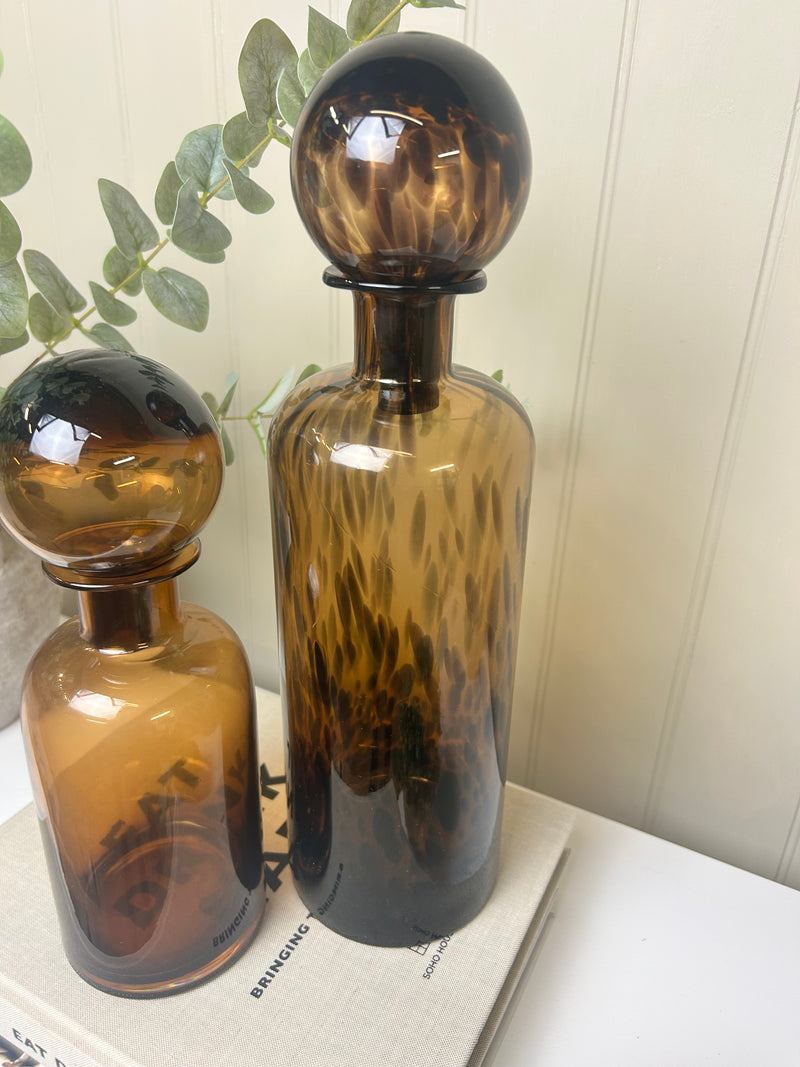 Large tortoise shell print glass bottle with top lid