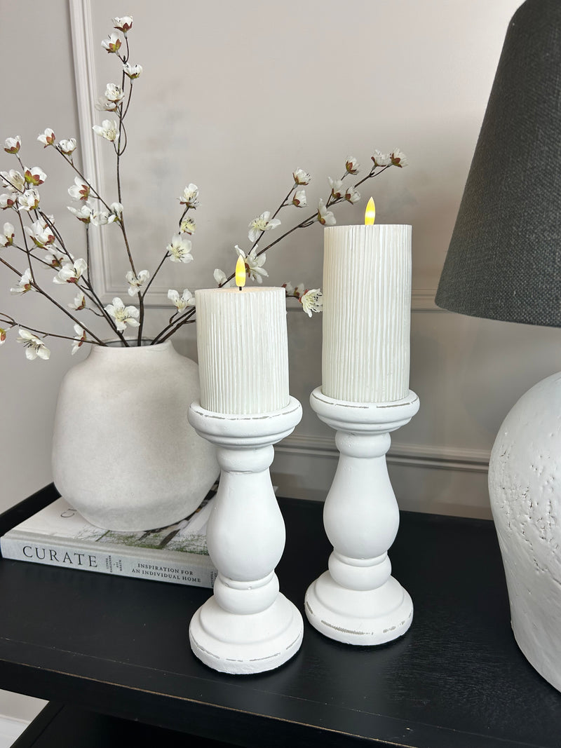Set of two chunky white candle sticks