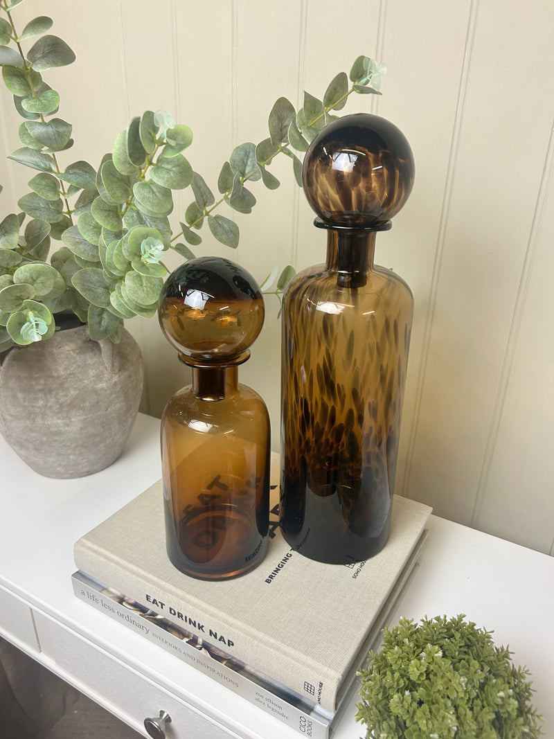 Black carved horse head on base stand