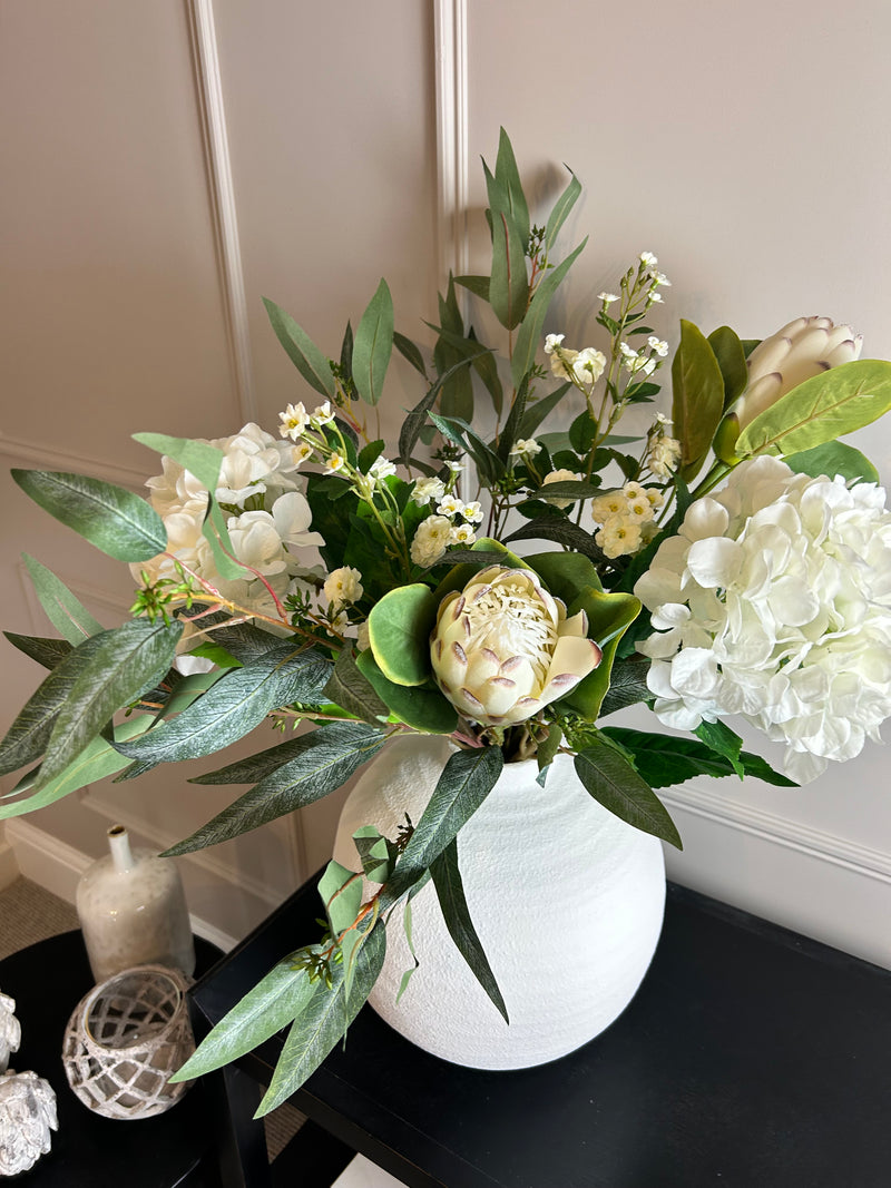 Off white closed protea stem