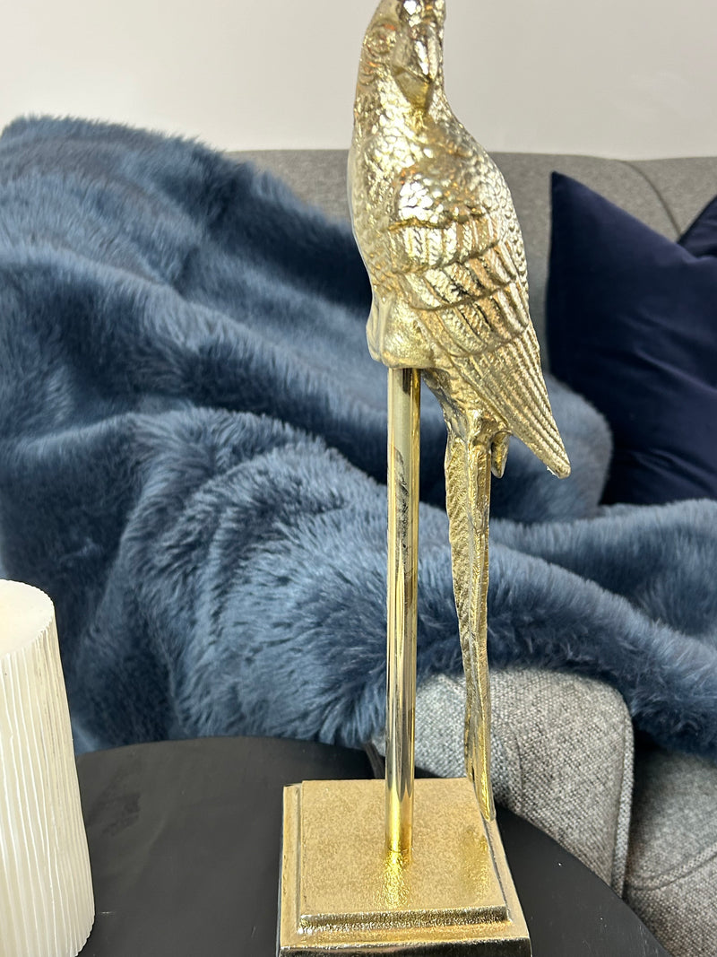 Gold parrot lamp with emerald green shade