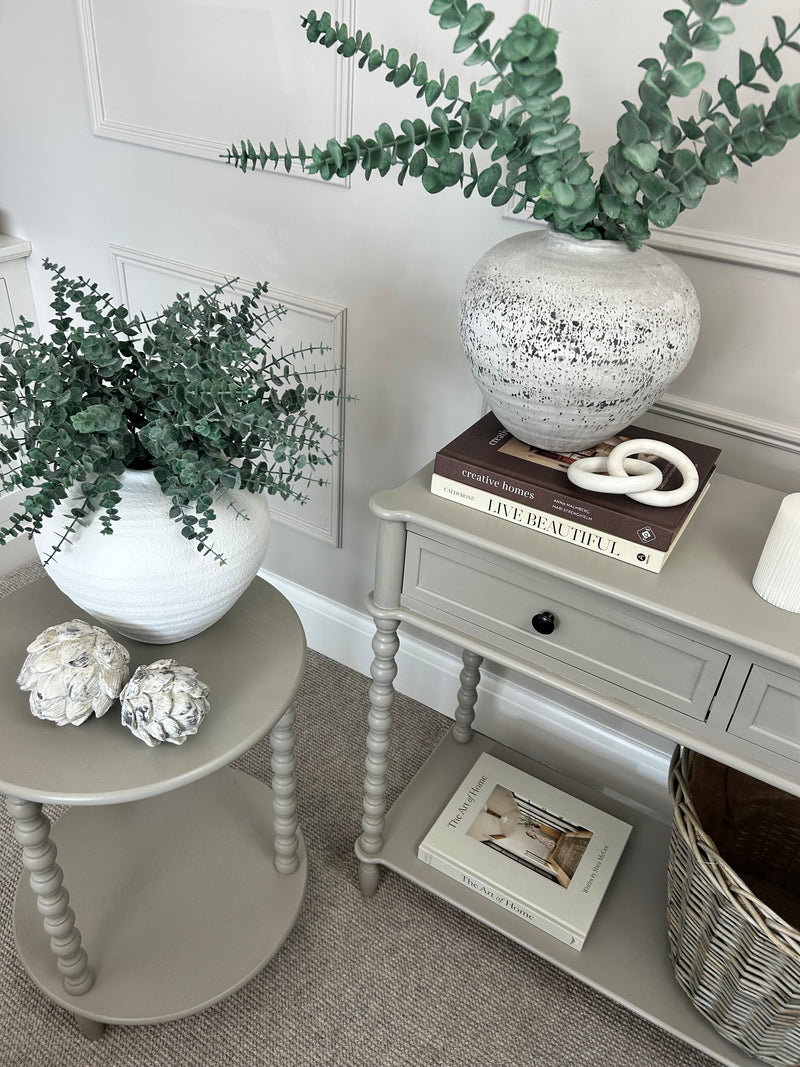 Neutral taupe console table with textured beaded legs