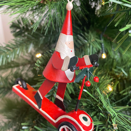 Traditional Metal Santa on scooter