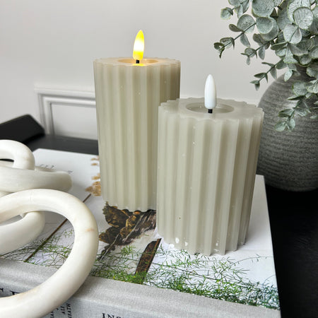 Pale taupe grey LED ribbed candle with timer two sizes