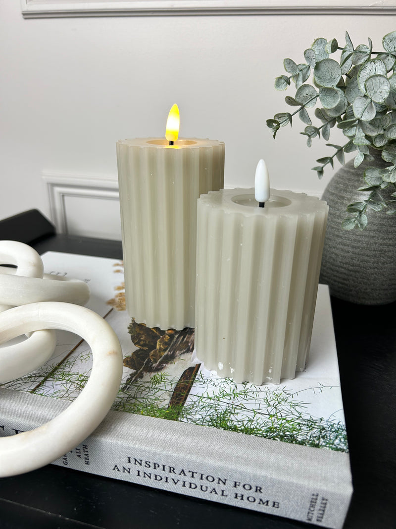 Pale taupe grey LED ribbed candle with timer two sizes