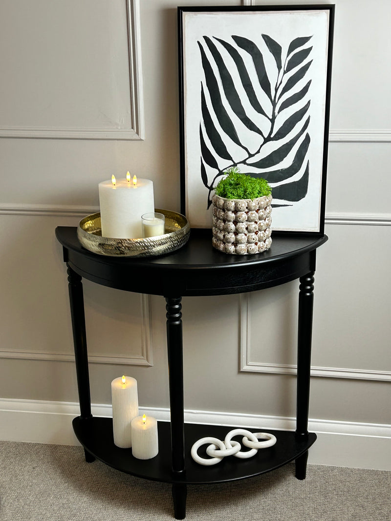 Black half moon table with turned legs