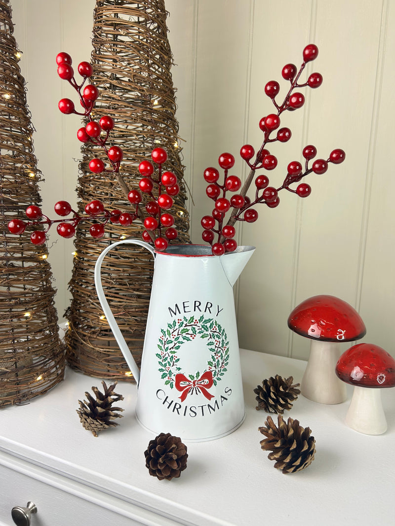 Metal jug with wreath detail