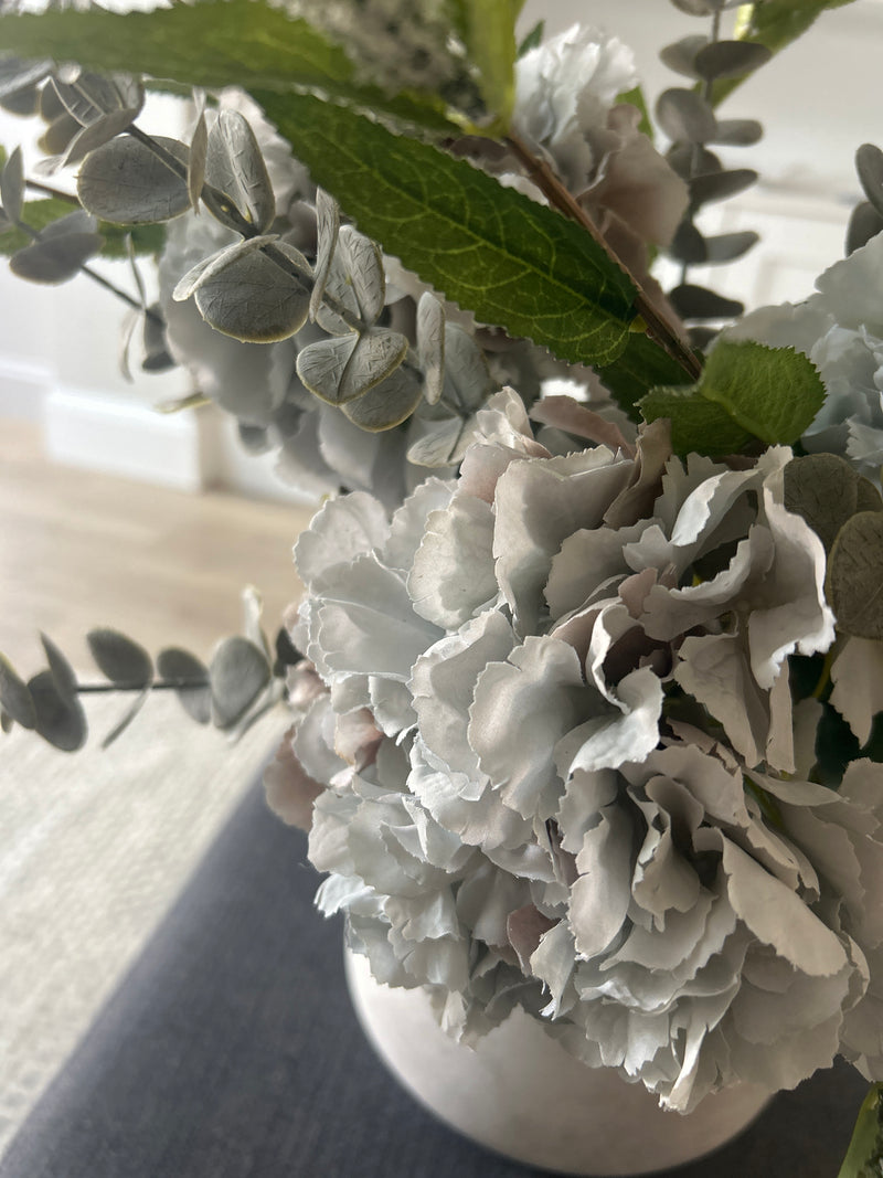 Bouquet arrangement grey/taupe hydrangeas white Veronica eucalyptus bunch.