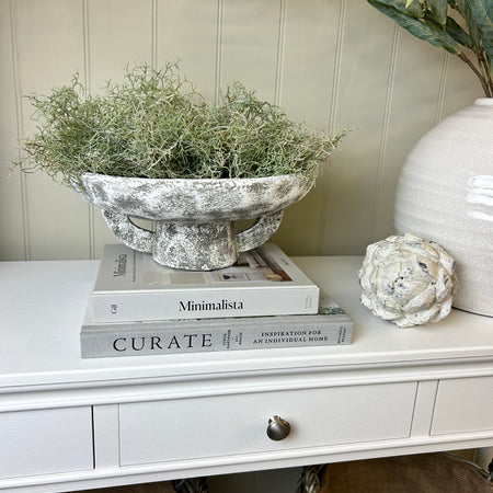 Round rustic stone bowl on foot base