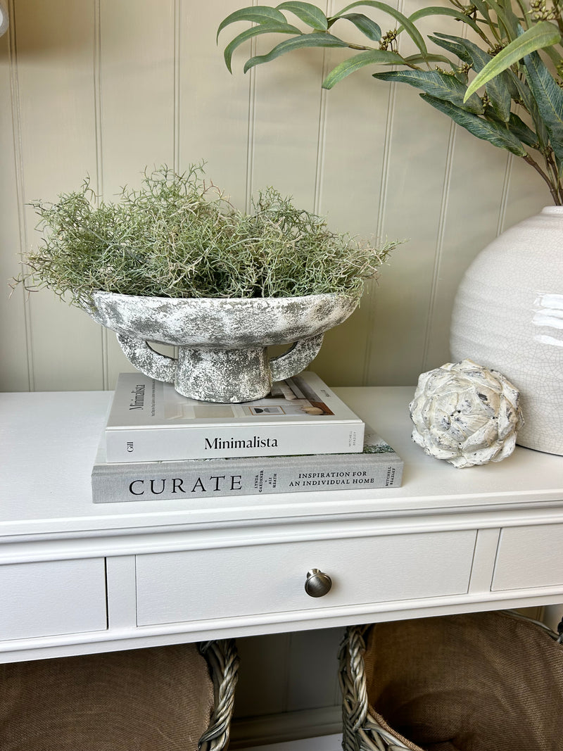 Round rustic stone bowl on foot base