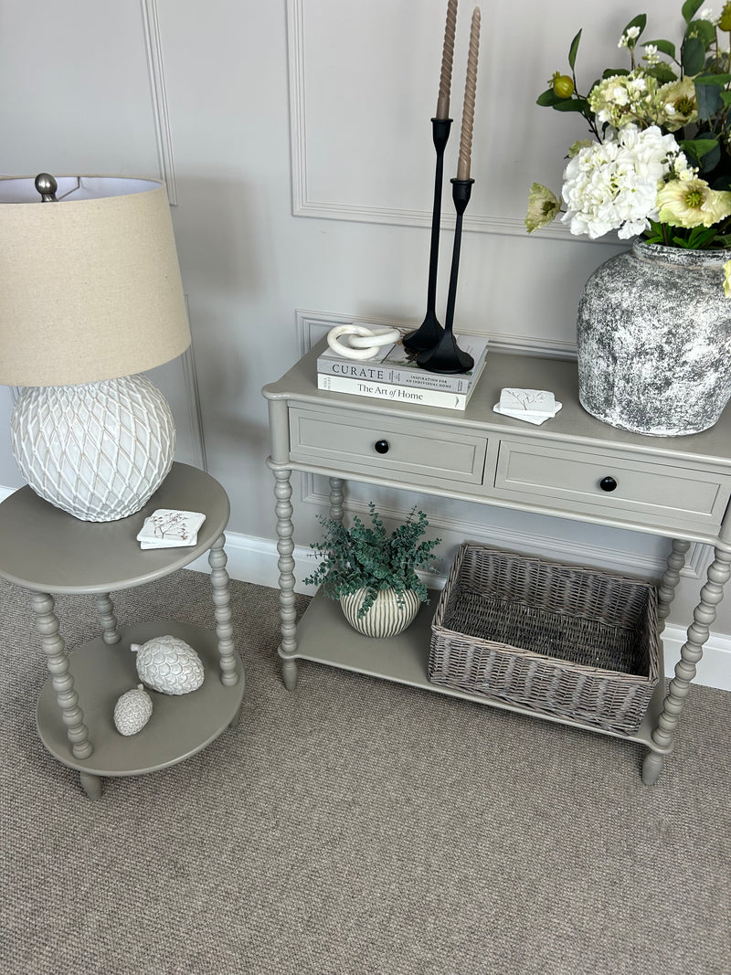Neutral taupe console table with textured beaded legs
