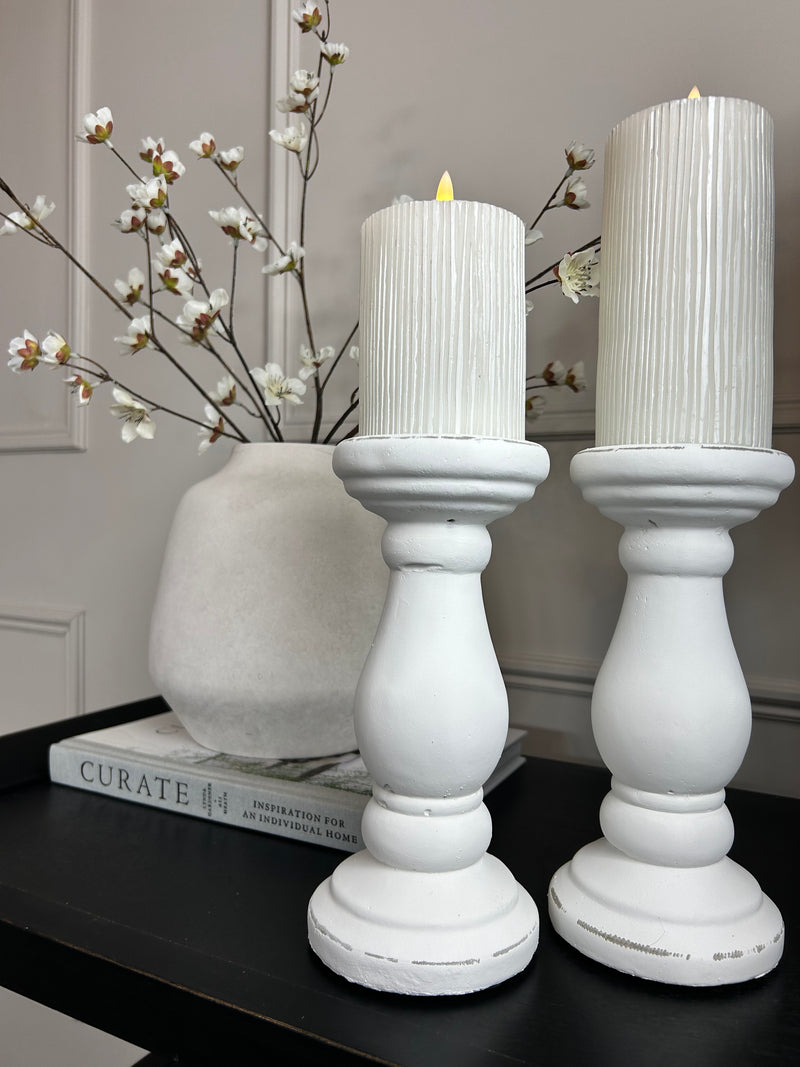 Set of two chunky white candle sticks
