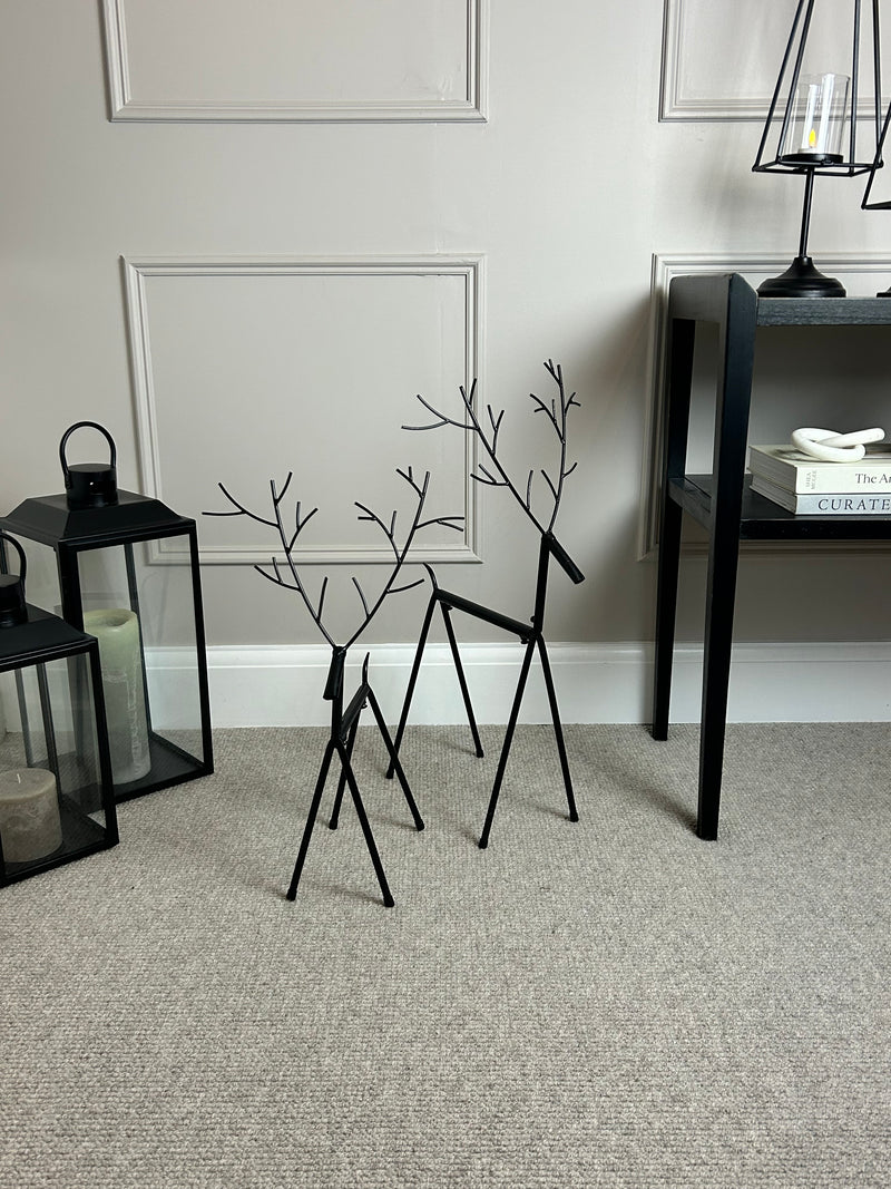 Set of two black metal reindeers 67cm
