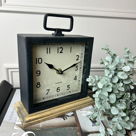 Black wooden based metal clock