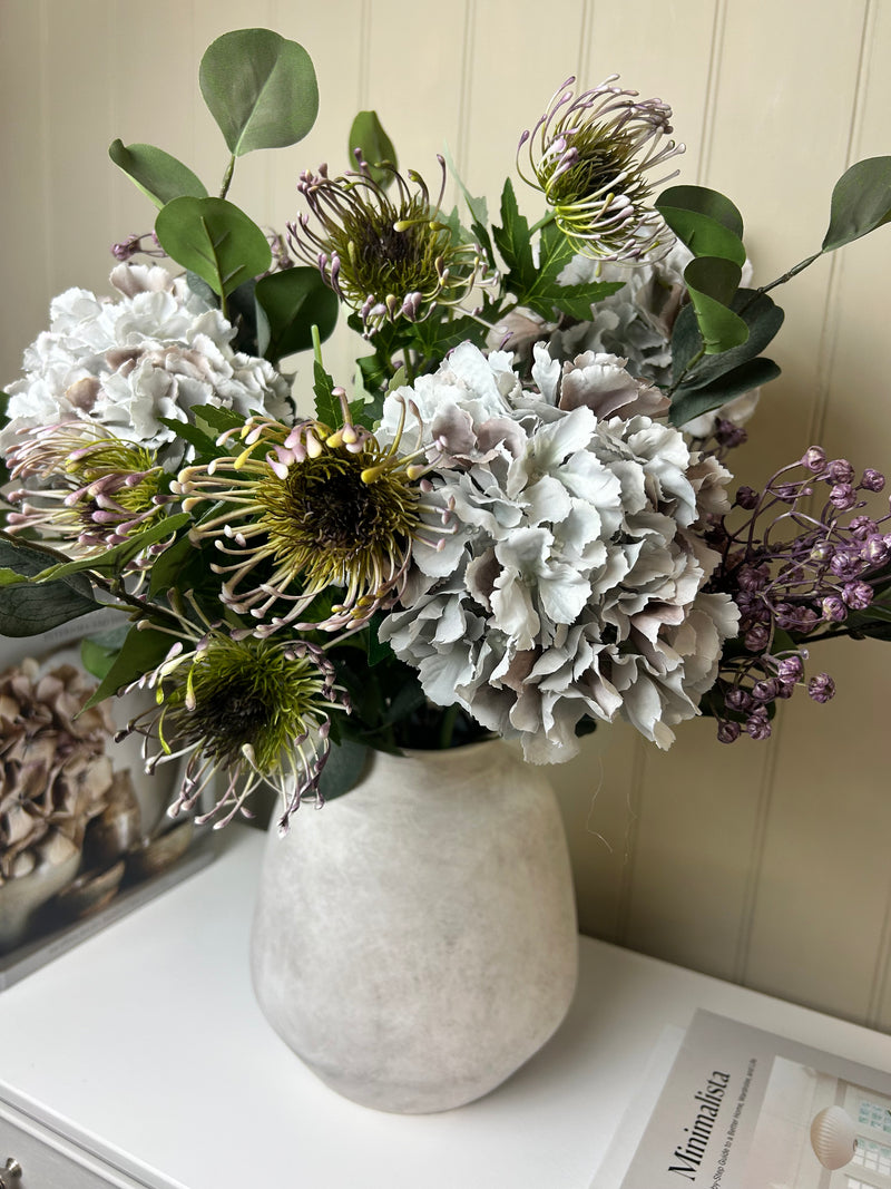 Green and purple protea stem head