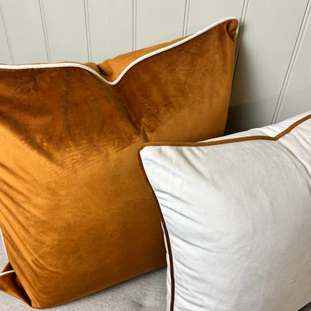Pair of Orange Rust and cream piped cushion covers