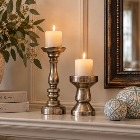 Set of two metal candle sticks