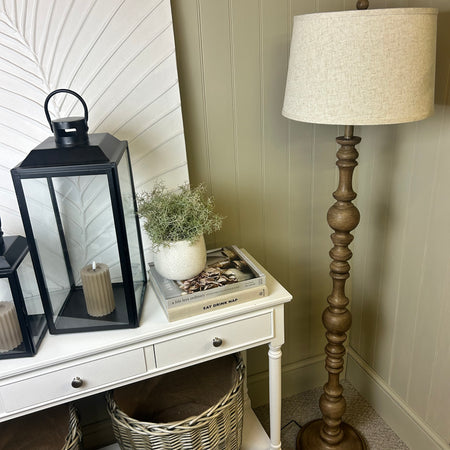 Wooden shaped floor lamp with linen shade