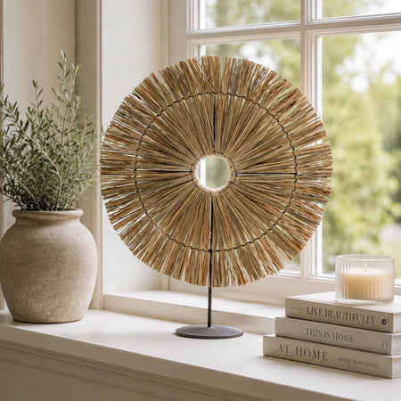 Round grass disk ornament on stand