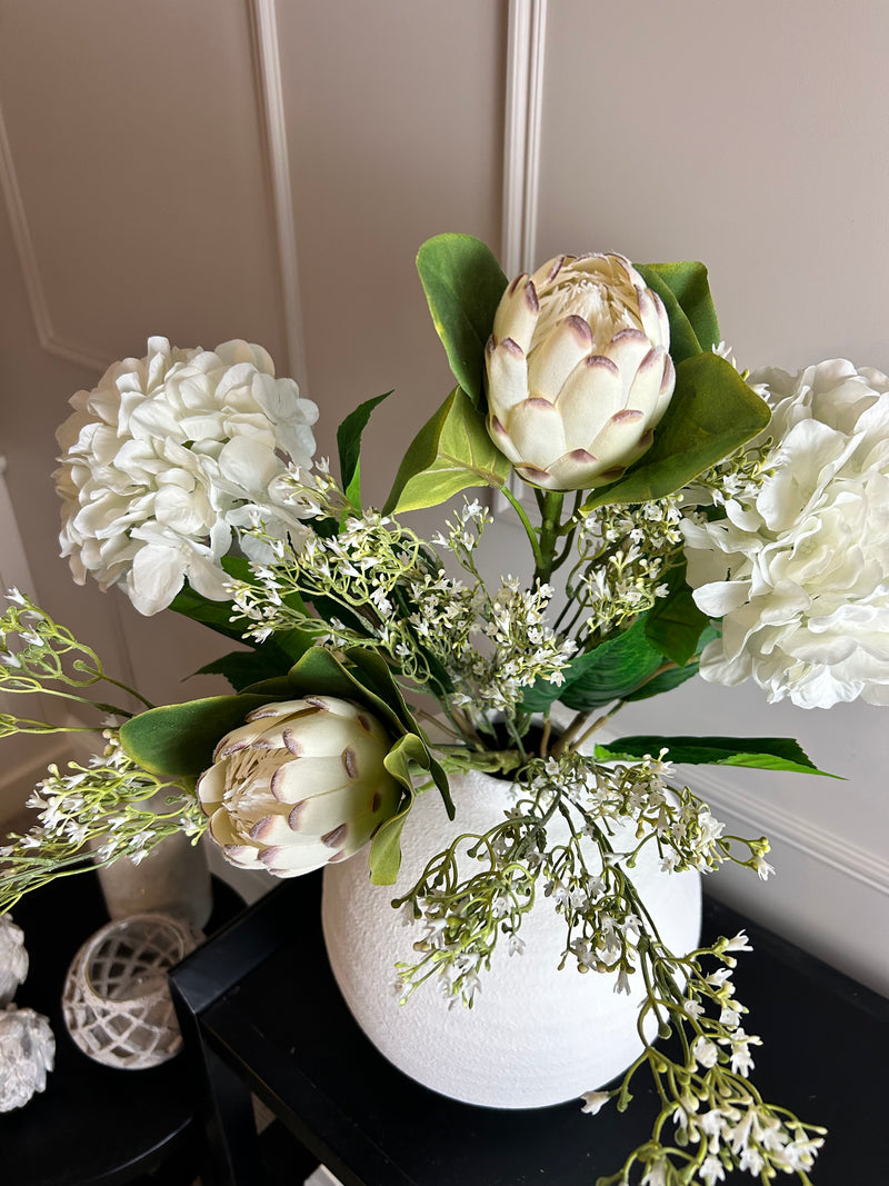 Off white closed protea stem