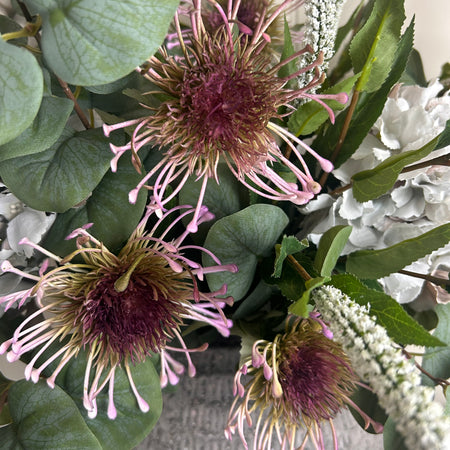 Green and purple protea stem head