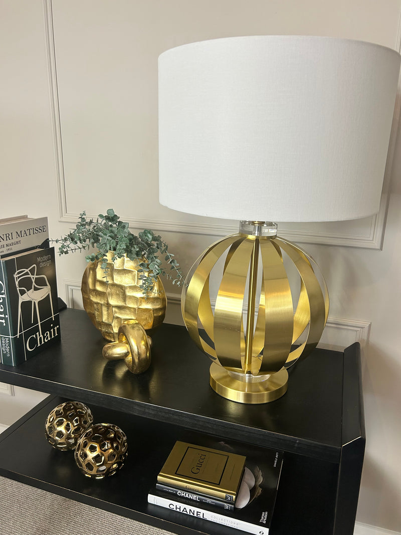 Gold metal round chunky lamp with white shade