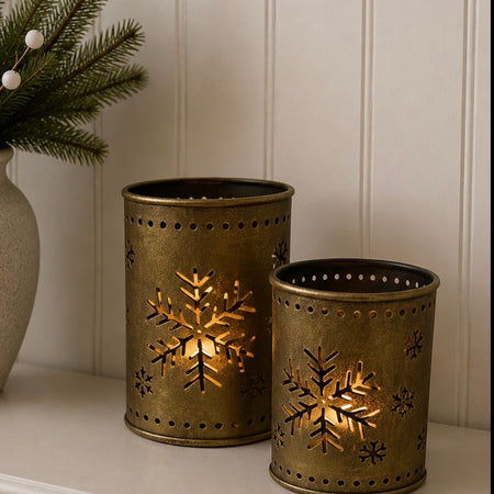 Set of two gold snowflake candle holders