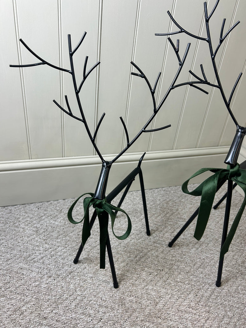 Set of two black metal reindeers 67cm