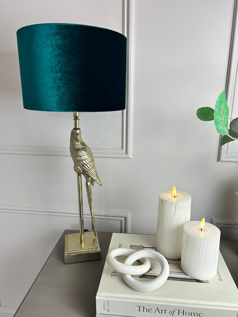 Gold parrot lamp with emerald green shade
