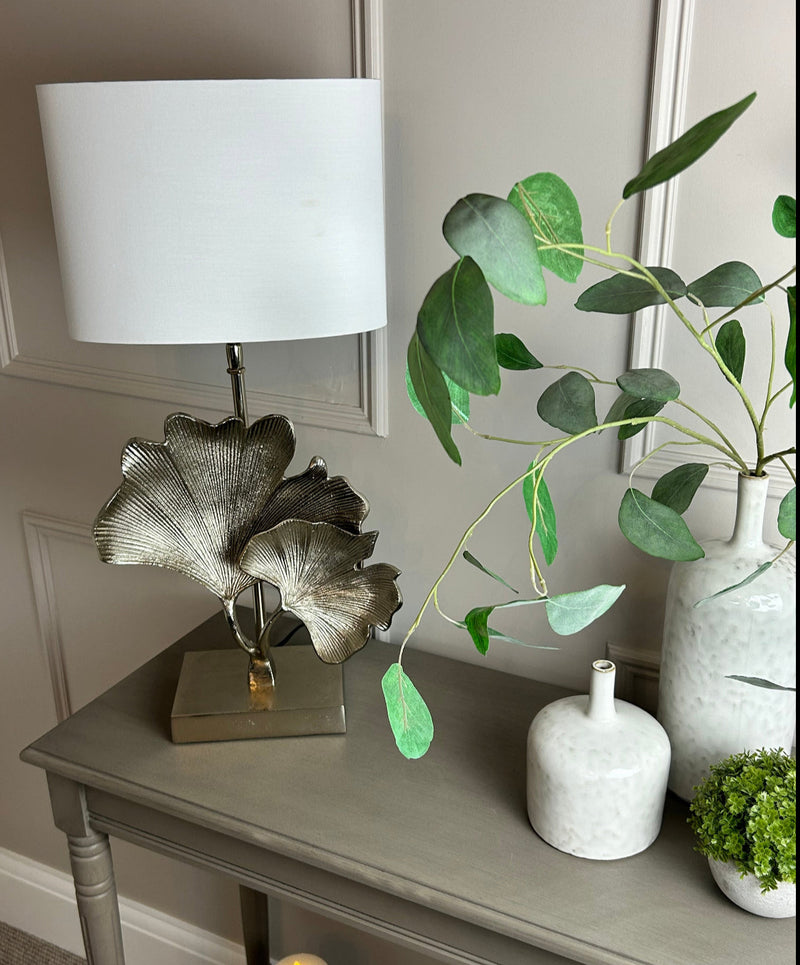 Two oval off white shades